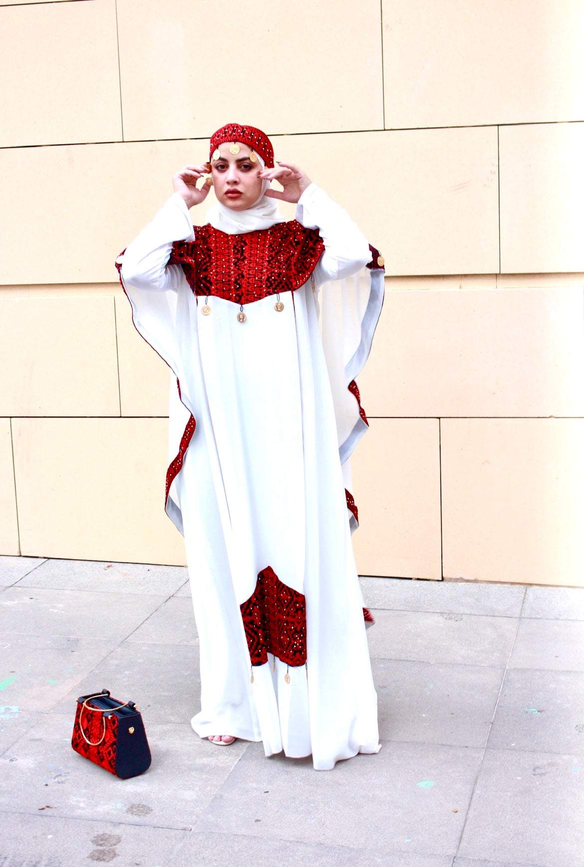 White dress embroidered with red