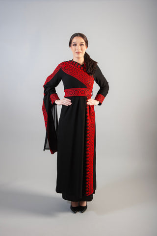 dress intricate embellishments, a gracefully wrapped waist belt, and a long sleeve for added refinement