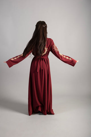 Two-piece abaya in a distinctive burgundy color with embroidery in the middle and sleeves