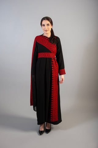 dress intricate embellishments, a gracefully wrapped waist belt, and a long sleeve for added refinement